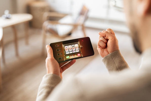 Mobile phone showing the kejuqq app with payment method selection screen